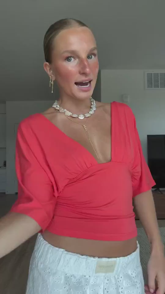Community UGC row 435: HILDE NECKLACE, ANNA DEEP V DRAPED SLEEVE TOP IN CORAL RED